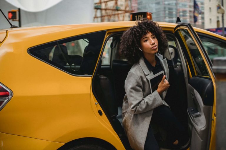 a person standing in a car