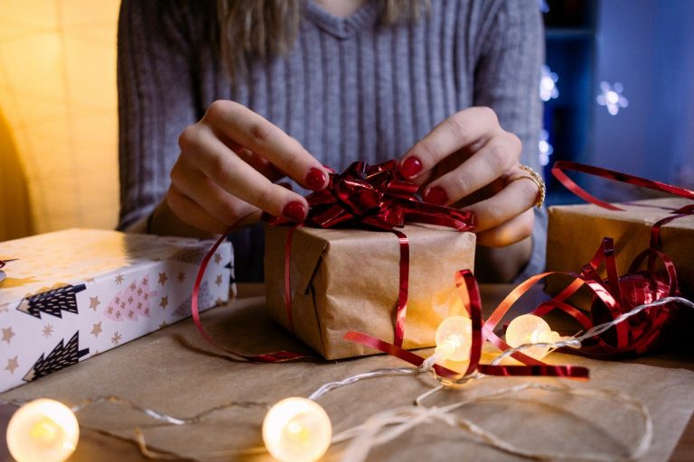 a person putting a present in a box