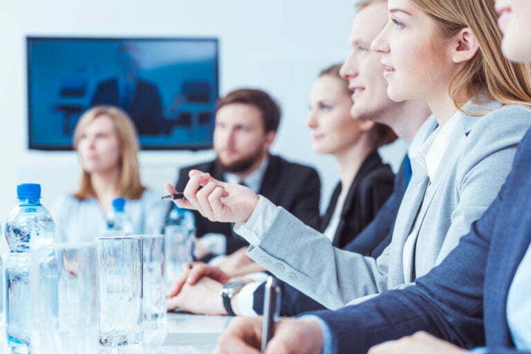 a group of people in a meeting