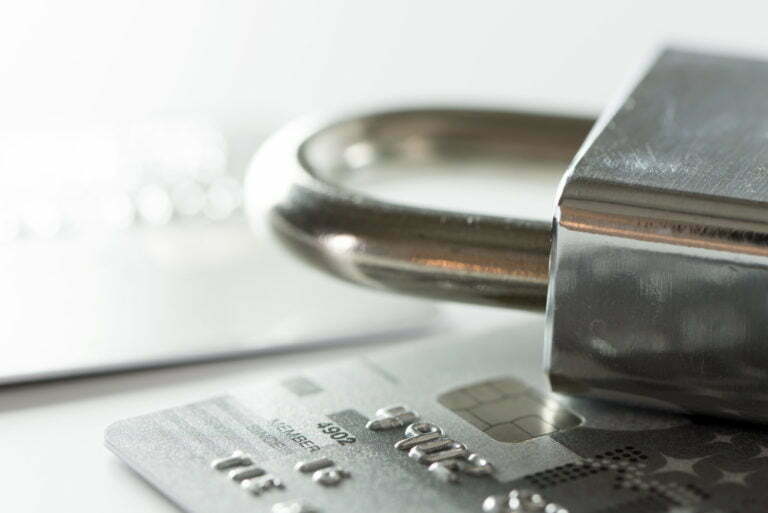 a close-up of a credit card and a calculator