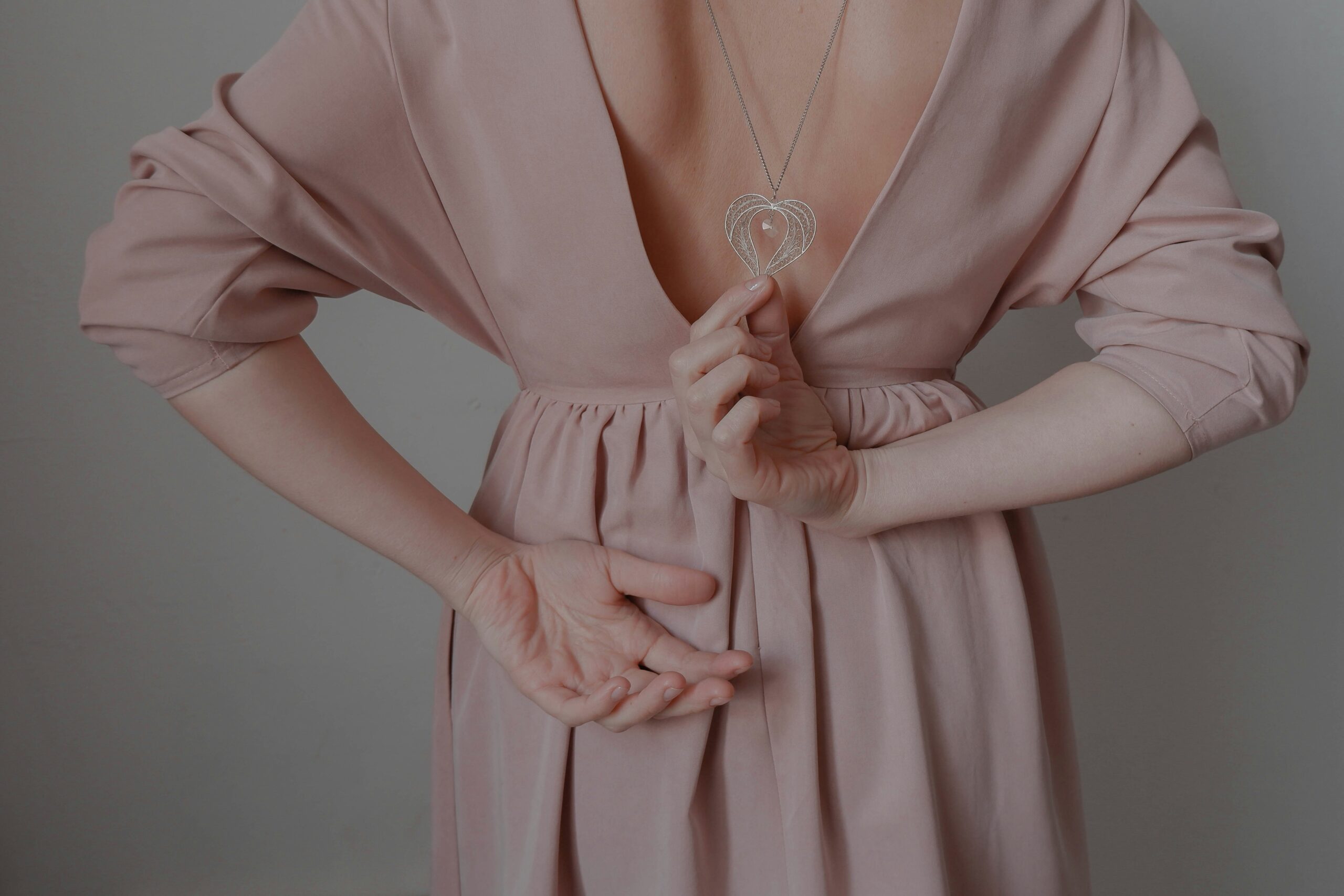 a person wearing a pink dress